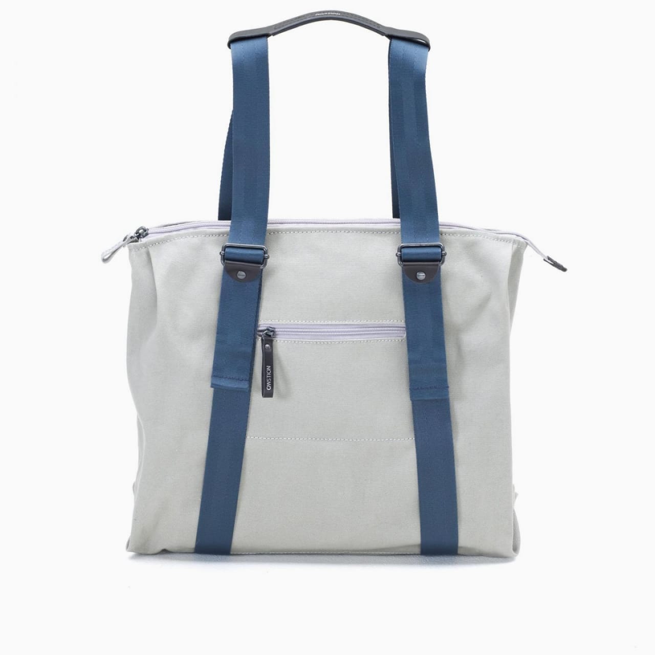 Front of zip tote bag with white canvas, blue canvas straps and handle, and front zipper pocket.