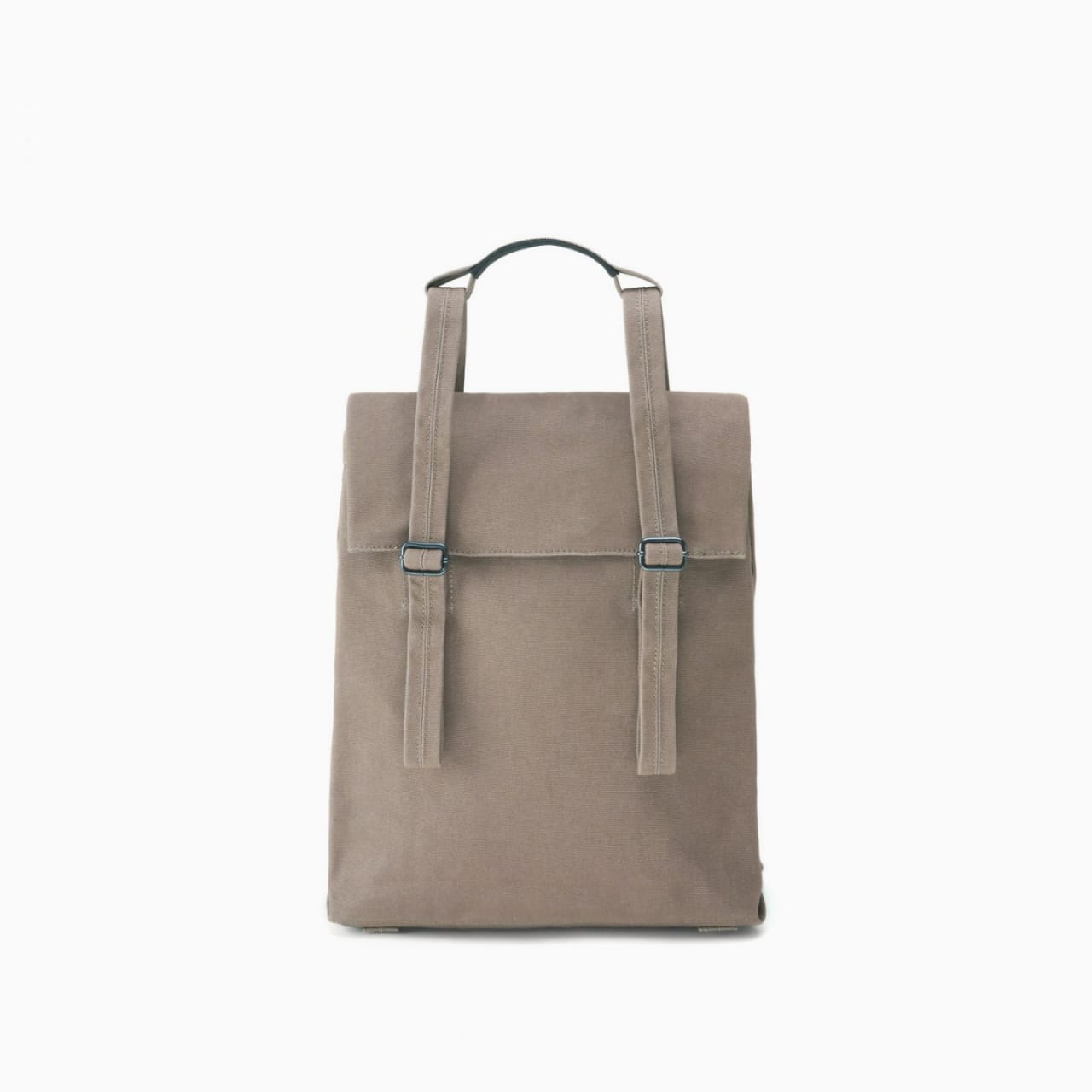 Front of tote with monochrome natural canvas body, straps, roll top, and handles.