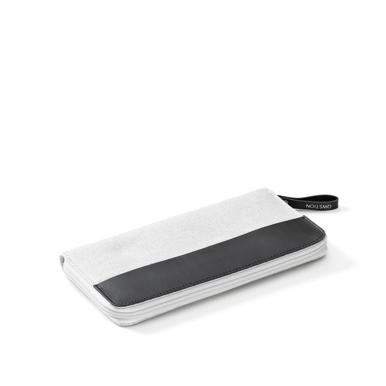 Front of carry clutch with white canvas body, black zipper pouch, and handle.