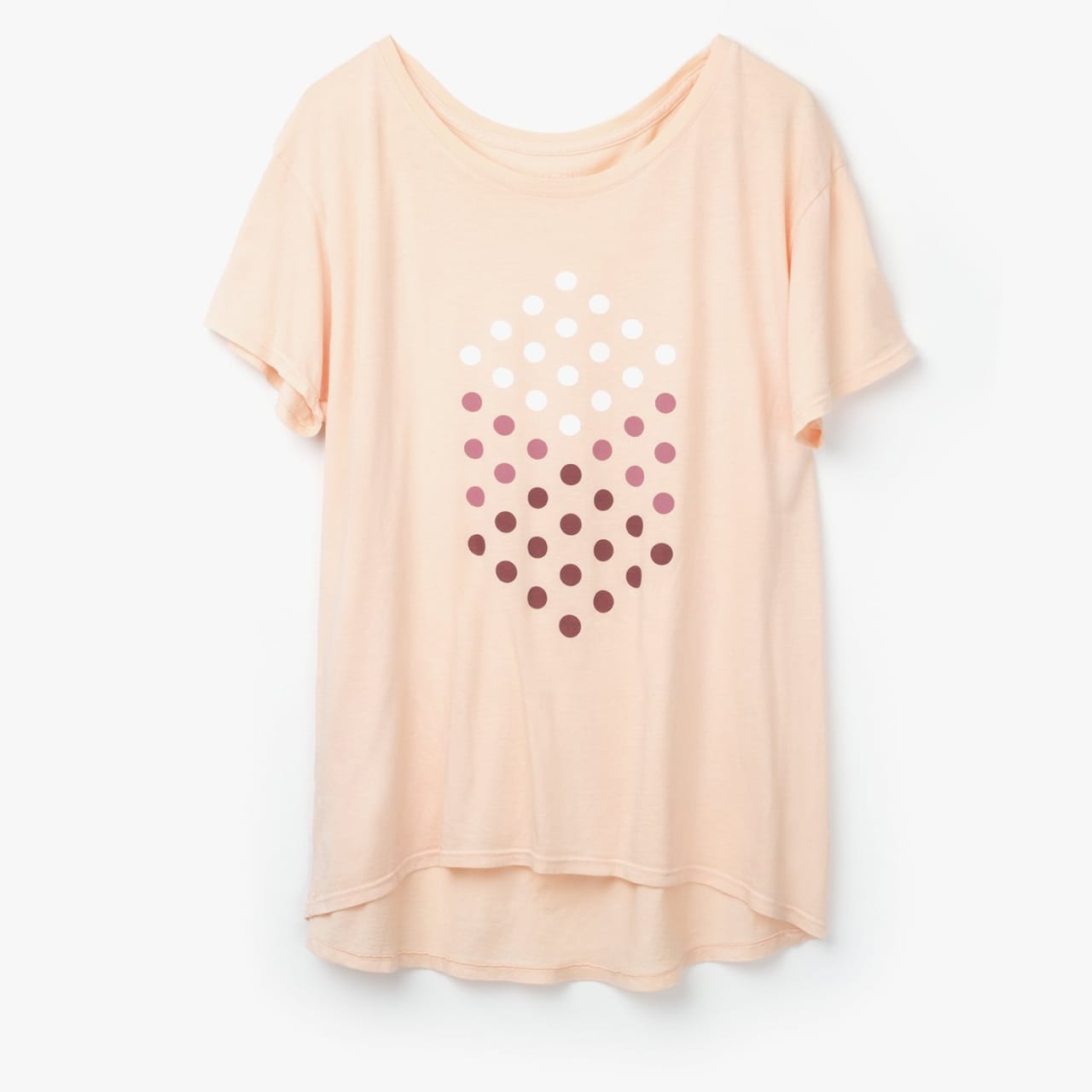 Front of women's artwork tee in peach color with white and red dots forming an isometric cube on the front.