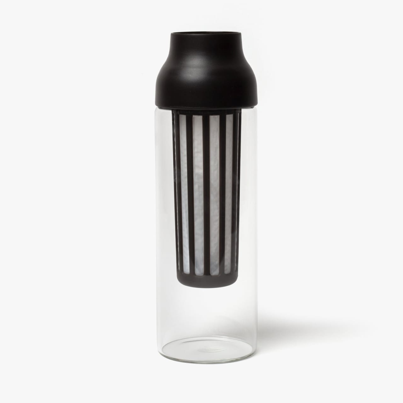 Glass bottle with black plastic pour top and mesh insert.