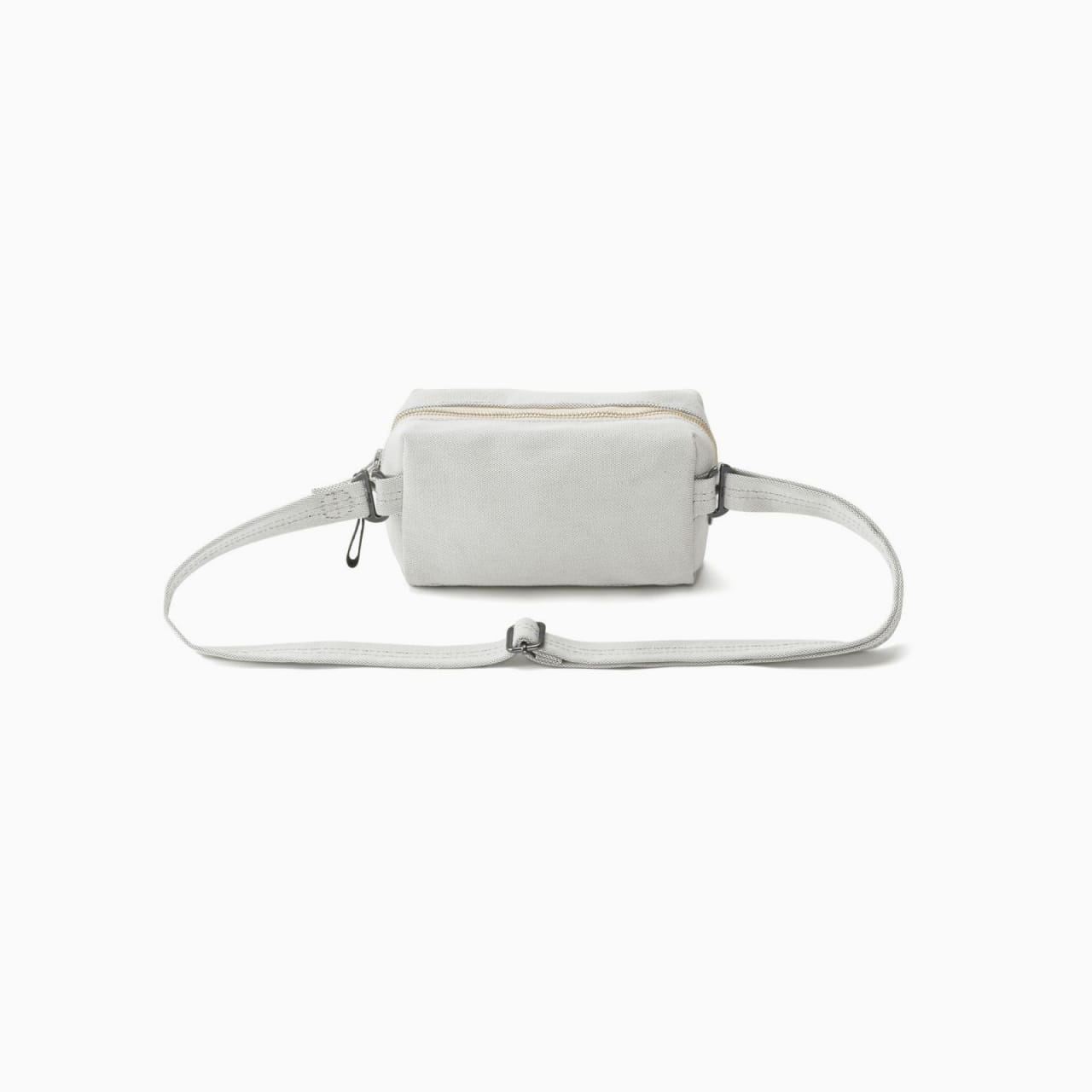 Light grey canvas shoulder bag with matching strap, zipper, and metal strap rings.