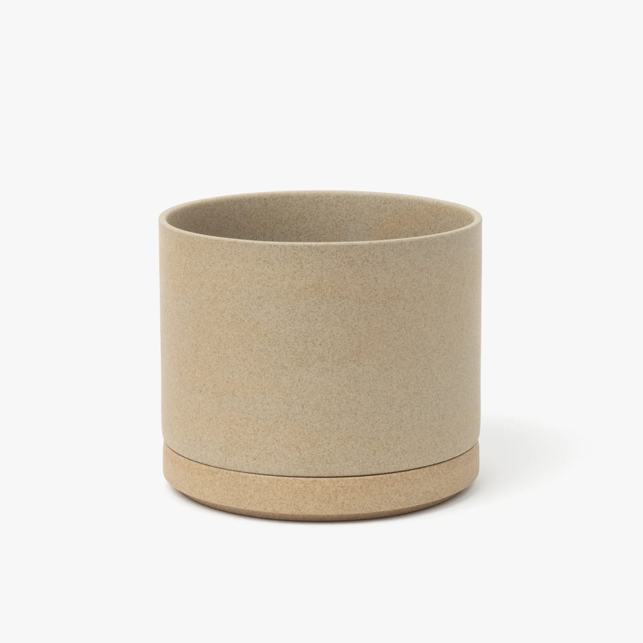 Large cylindrical planter with textured natural porcelain color and separate drainage base.