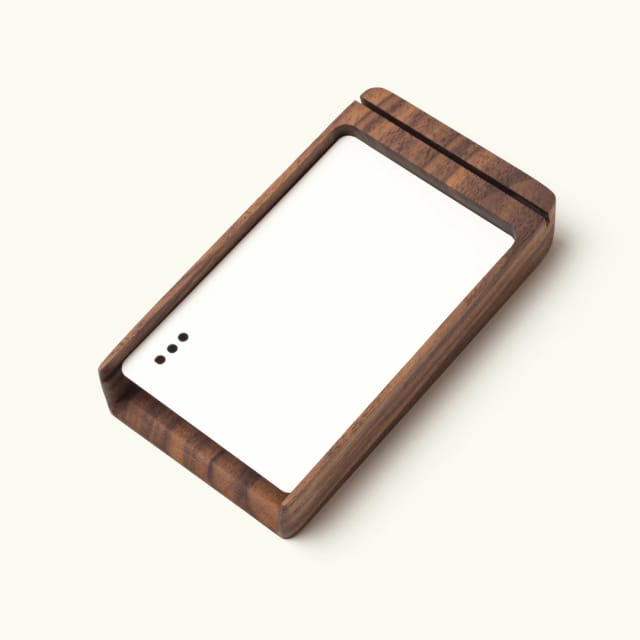 Walnut card tray with white powder coated steel divider and 3 punchout holes.