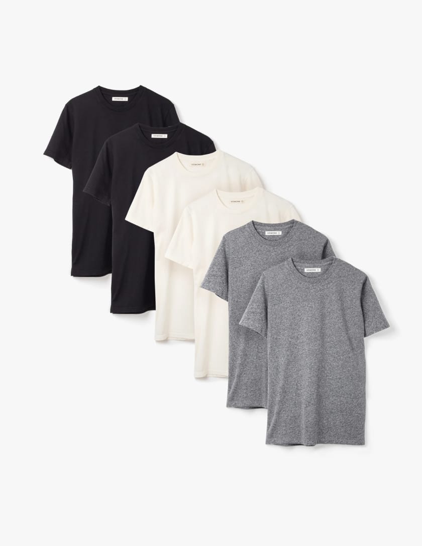 Two each of gray, white, and black shirts laying flat.