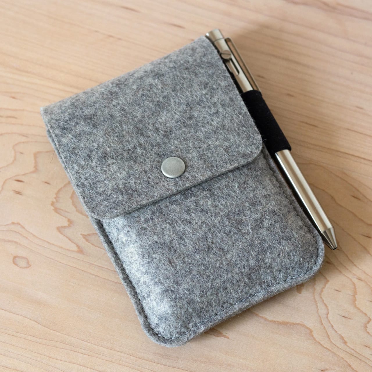 Hand stitched, orange leather long wallet.