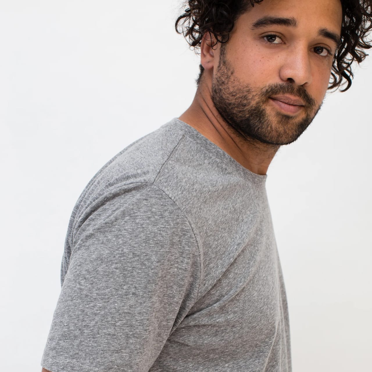 Model wearing light heather gray t-shirt.