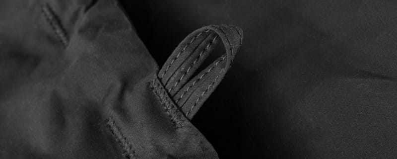 Double stitched black canvas hook loop.