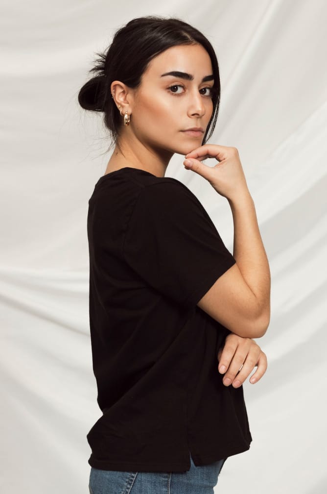 Side profile of women's Basic Tee in black.